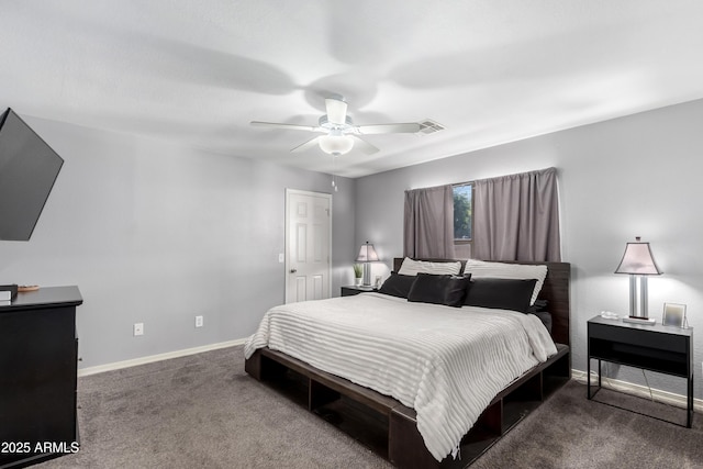 bedroom with dark colored carpet and ceiling fan