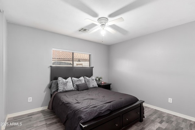 bedroom with ceiling fan and wood-type flooring