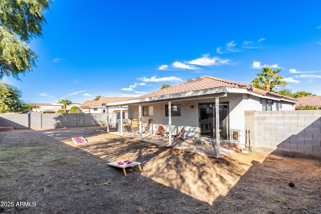 rear view of house featuring a patio area