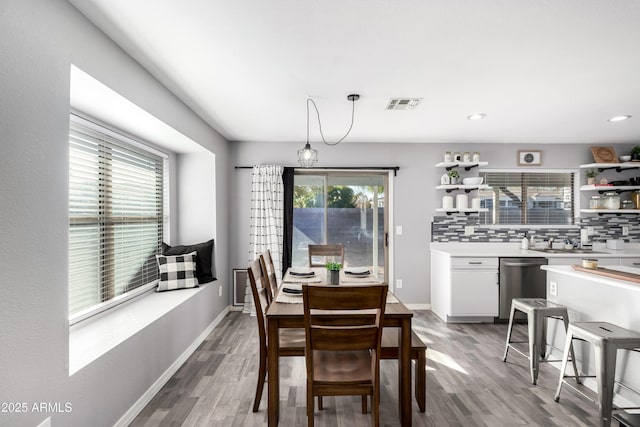 dining area featuring wood-type flooring