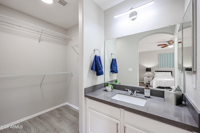 bathroom with vanity and ceiling fan