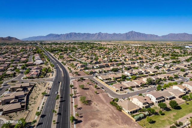 birds eye view of property featuring a mountain view