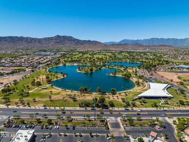 drone / aerial view featuring a water and mountain view