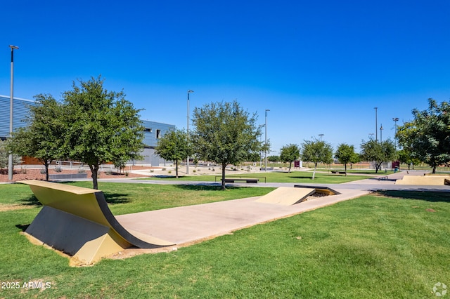 view of property's community with a yard