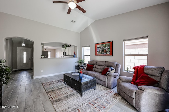 living room with vaulted ceiling and ceiling fan