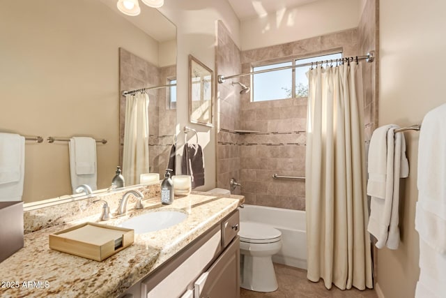 full bathroom featuring vanity, tile patterned flooring, toilet, and shower / bath combo with shower curtain