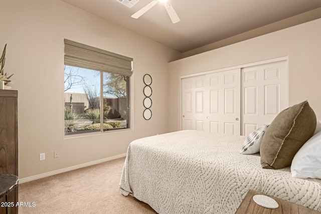 bedroom with carpet flooring, ceiling fan, and a closet