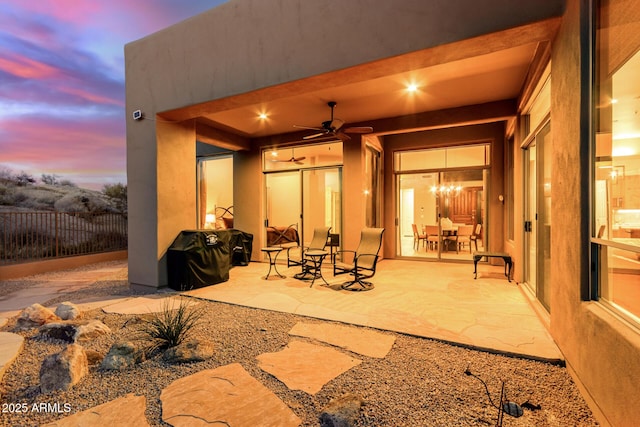 patio terrace at dusk with ceiling fan