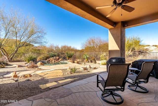 view of patio featuring ceiling fan