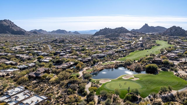 drone / aerial view with a water and mountain view