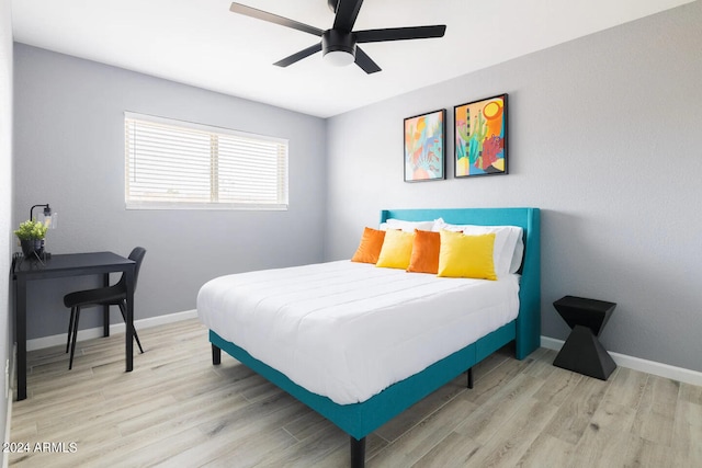 bedroom featuring ceiling fan and light wood-type flooring