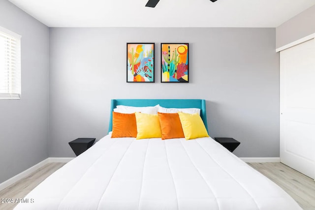 bedroom featuring ceiling fan and light hardwood / wood-style flooring