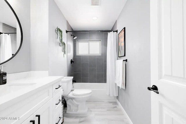 full bathroom featuring vanity, toilet, and shower / bath combo with shower curtain