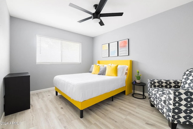 bedroom featuring light wood-type flooring and ceiling fan