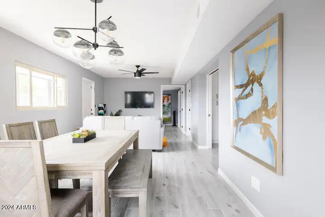 dining room featuring ceiling fan and light wood-type flooring