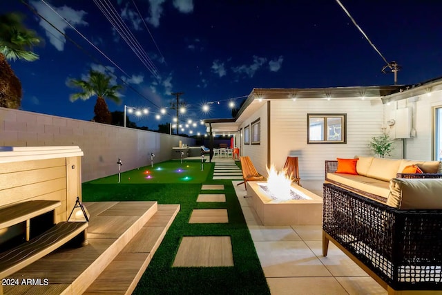 exterior space with an outdoor living space with a fire pit