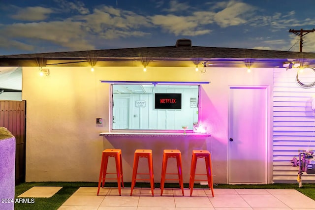 bar featuring tile patterned floors