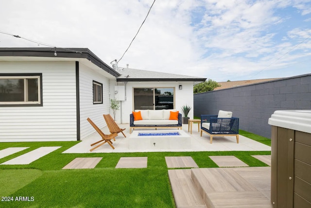 back of property featuring an outdoor living space with a fire pit and a patio