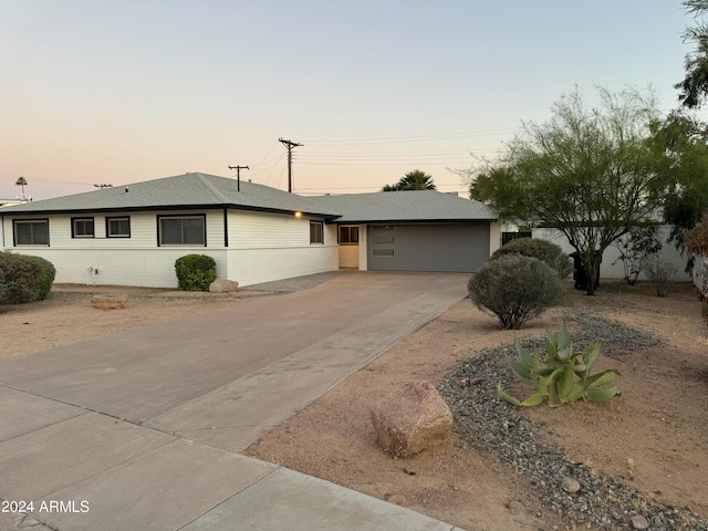 ranch-style home with a garage