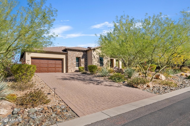 5420 E Duane Ln, Cave Creek, AZ 85331 - view of front of house featuring stone siding, a garage, stucco siding, and driveway