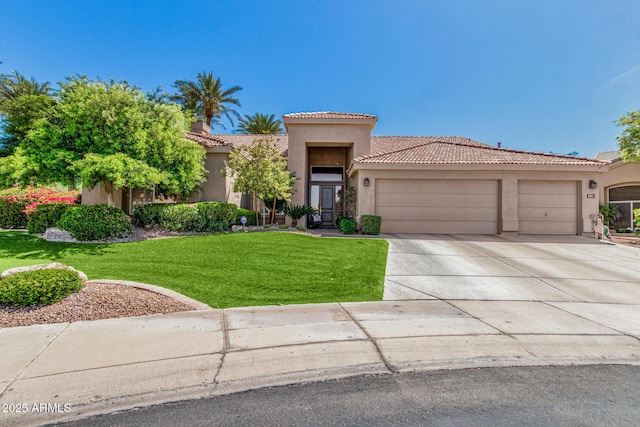 view of front of home featuring a front lawn, a tile roof, a garage, stucco siding, and driveway
