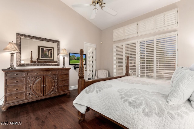 bedroom with baseboards, dark wood finished floors, and high vaulted ceiling