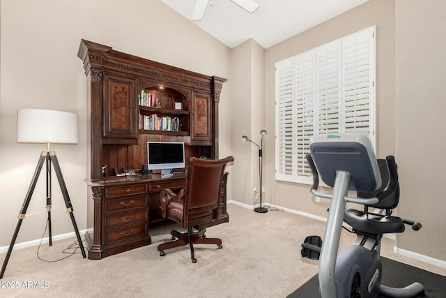 home office featuring baseboards and light colored carpet