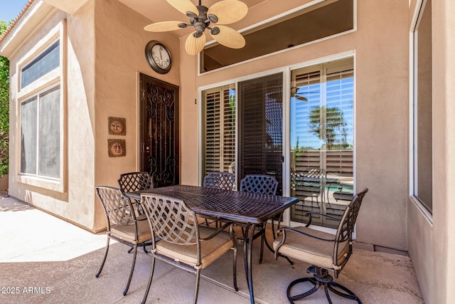 view of patio / terrace featuring outdoor dining area and ceiling fan