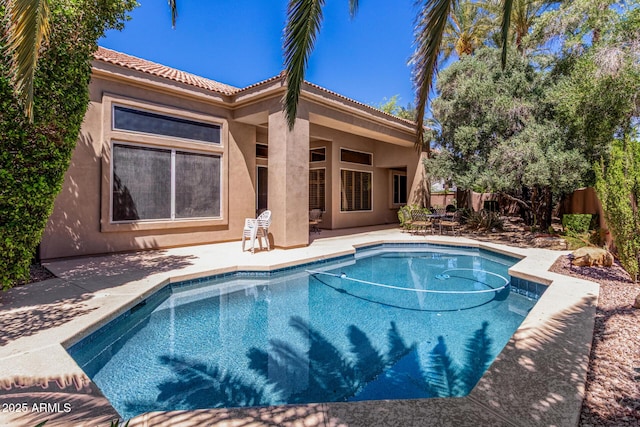 view of swimming pool featuring a fenced in pool, a fenced backyard, and a patio area