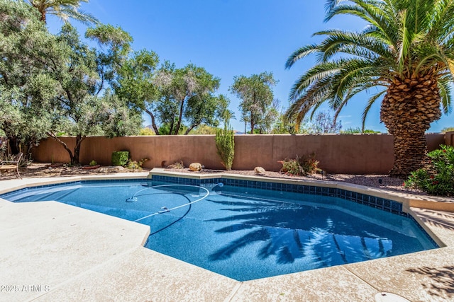 view of swimming pool with a fenced backyard and a fenced in pool