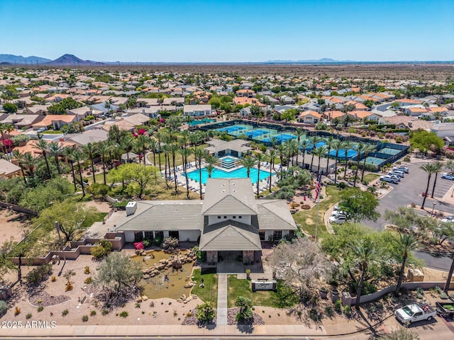 birds eye view of property with a mountain view