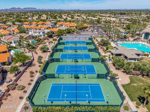 birds eye view of property with a mountain view