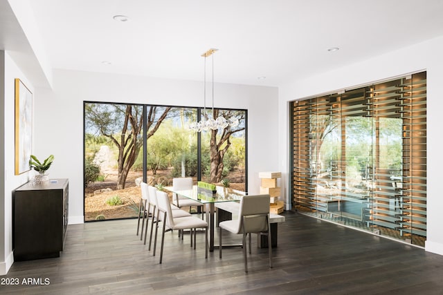 dining room featuring a chandelier and dark hardwood / wood-style flooring