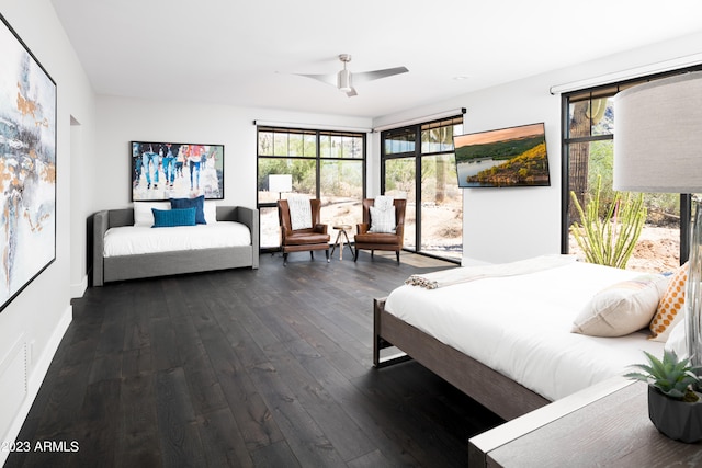 bedroom featuring ceiling fan and dark hardwood / wood-style flooring