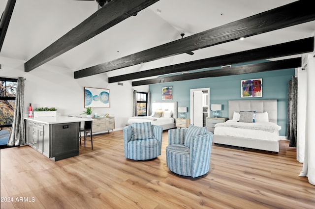 living room with light hardwood / wood-style floors and beamed ceiling