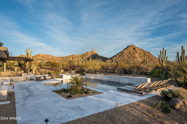 exterior space featuring a patio and a mountain view