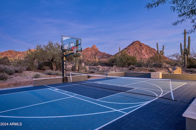 view of basketball court with a mountain view