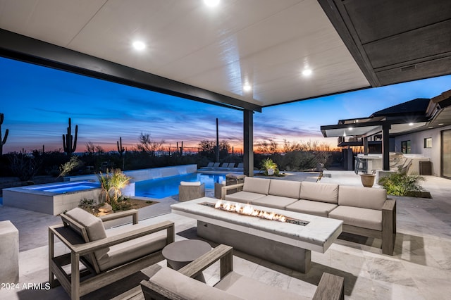 patio terrace at dusk featuring an outdoor living space with a fire pit and a pool with hot tub