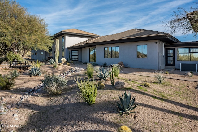 rear view of property featuring a patio