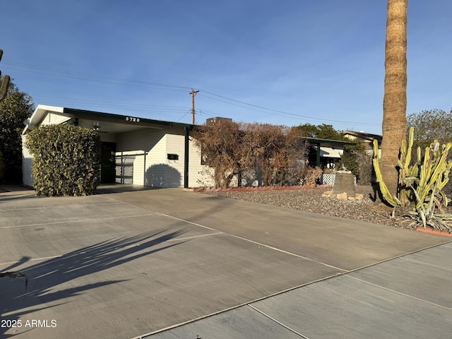 view of front of property with a carport