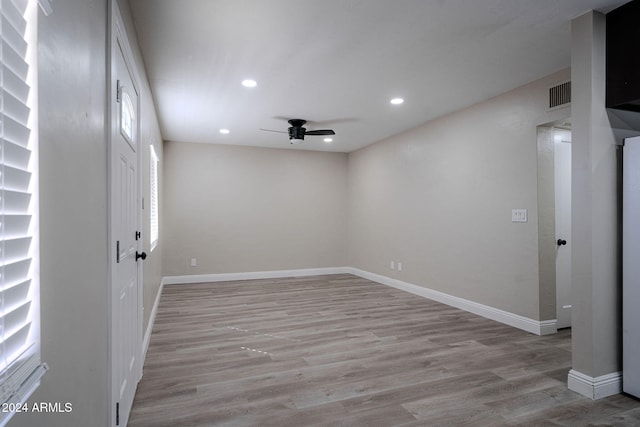 empty room featuring light hardwood / wood-style floors and ceiling fan