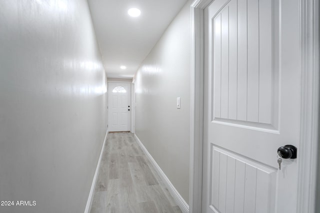 hallway with light wood-type flooring