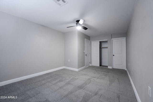 unfurnished bedroom featuring carpet flooring and ceiling fan