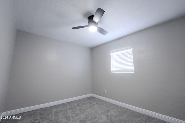 carpeted empty room with a textured ceiling and ceiling fan