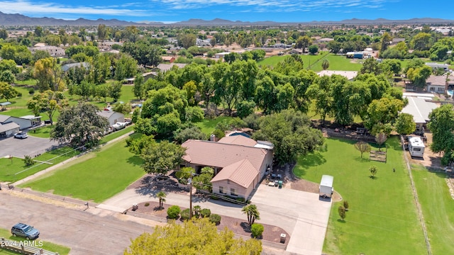 birds eye view of property featuring a mountain view