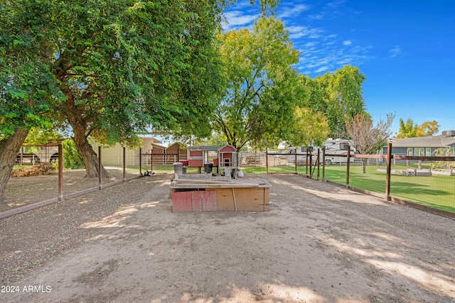 view of play area with an outbuilding