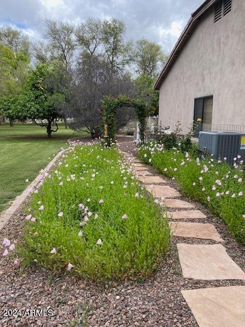 view of yard featuring central AC