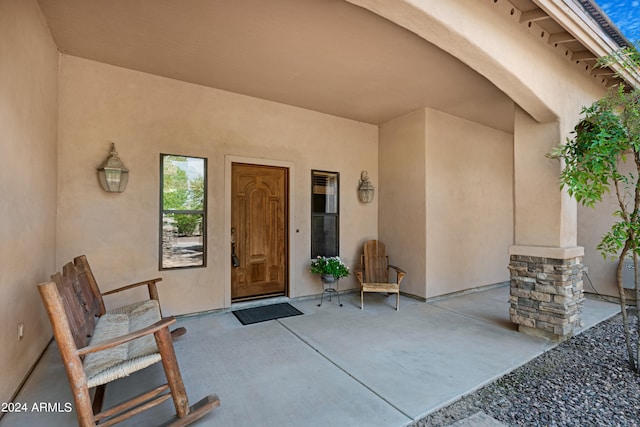 entrance to property featuring a patio