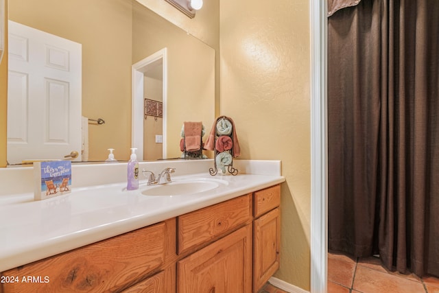 bathroom featuring tile patterned flooring and vanity