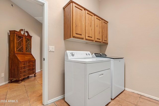 laundry area featuring cabinets and independent washer and dryer